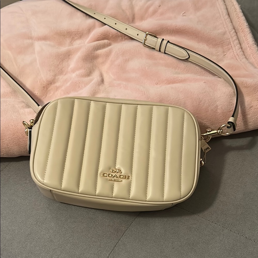 Coach Cream Crossbody Bag with Quilted Texture and Adjustable Strap